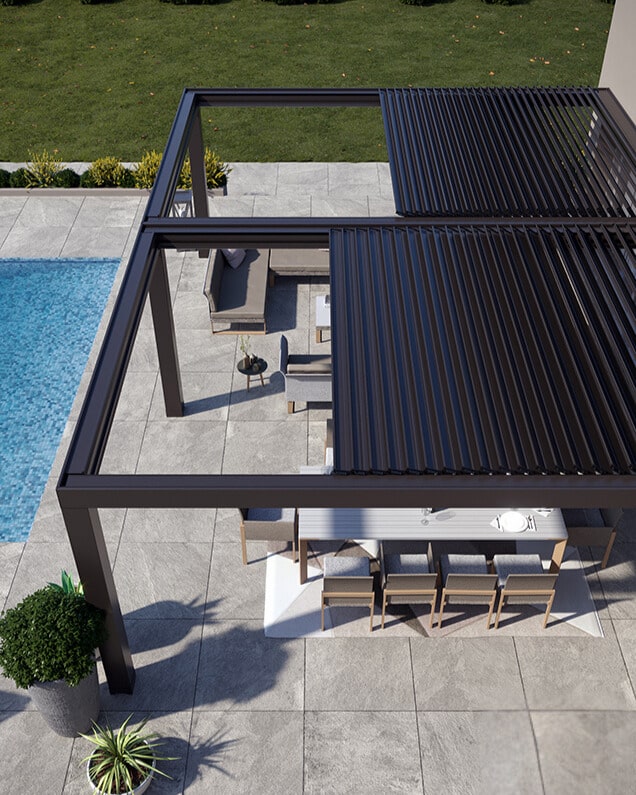 Vue aérienne d’une double pergola bioclimatique rétractable à Beaucouzé, avec lames orientables et partiellement ouvertes.